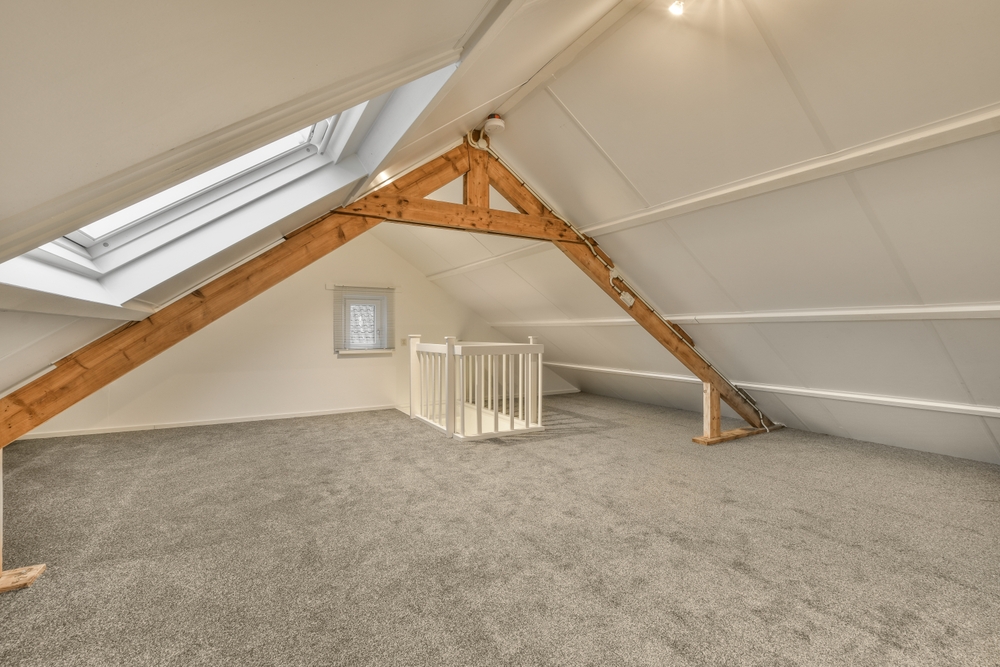 An,Attic,Room,With,Carpet,And,Skylights,On,The,Roof,